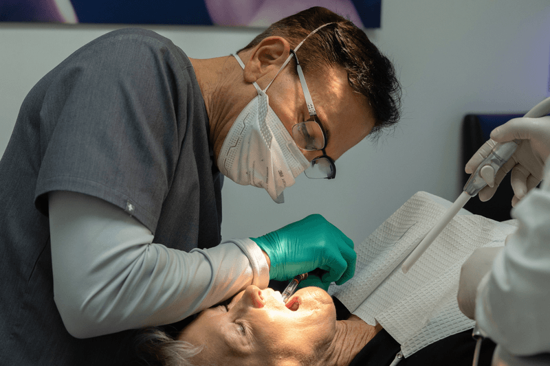 Older woman getting dental exam