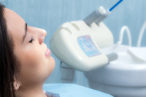 relaxed woman in a dental chair, routine checkup