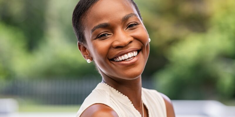 profile of an attractive woman showing her perfect smile