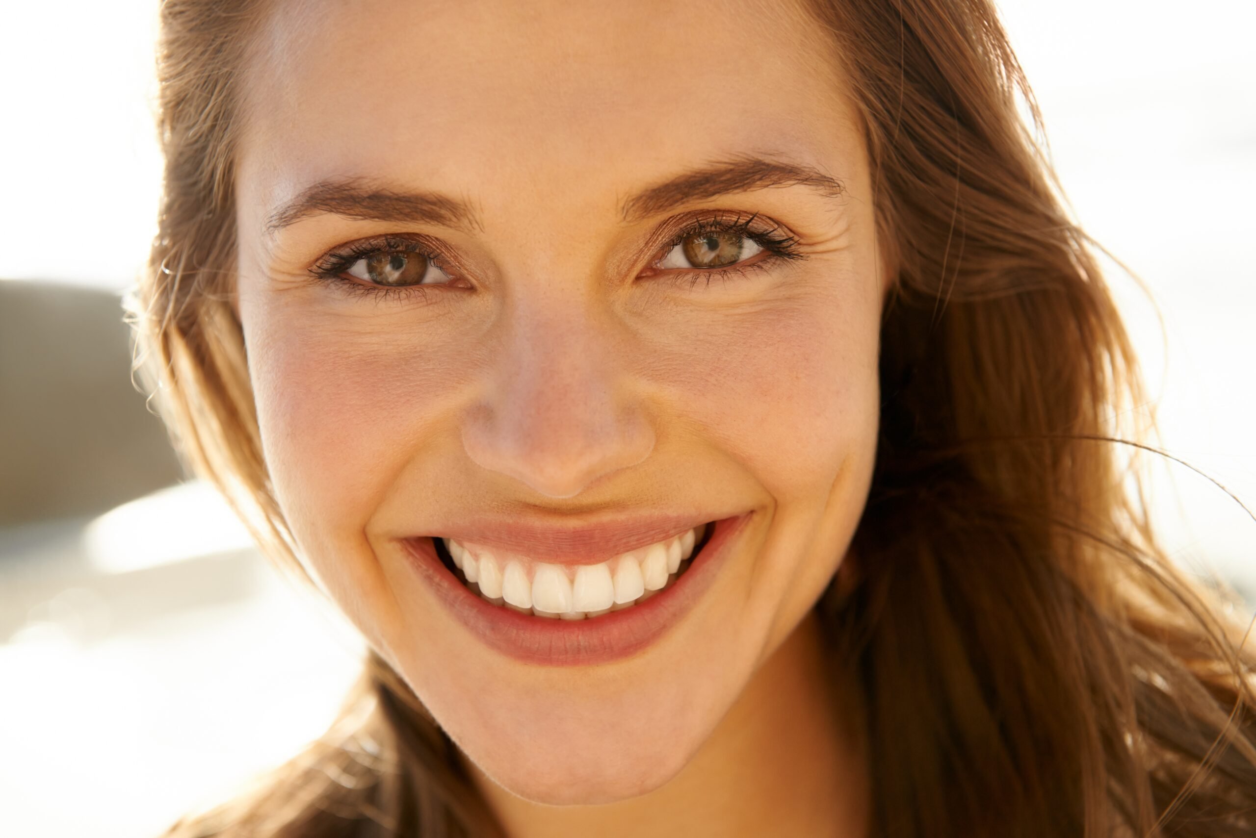 Portrait, smile and woman on beach with perfect teeth