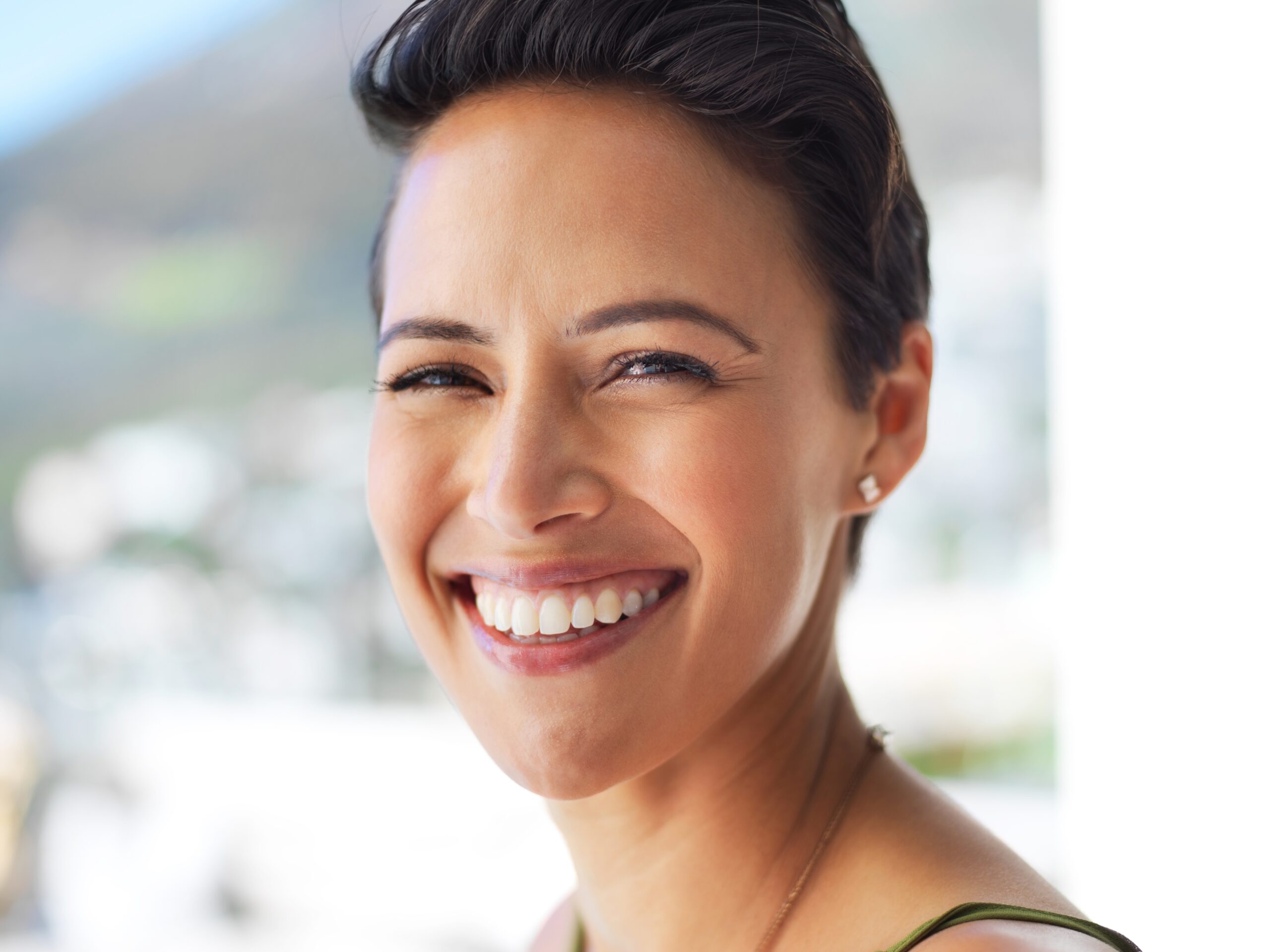 closeup of a woman with a perfect smile, dental implants