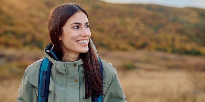 happy woman smiling outdoors, perfect smile